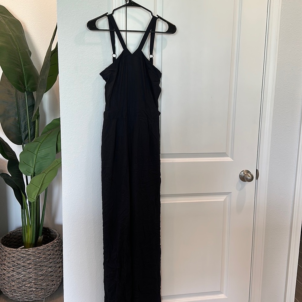 NWT Valija Jumpsuit. Size Medium. Navy. Open sides. Wrinkled from moving.